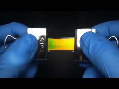 When mechanochromic photonic crystals are stretched or compressed, their nanoscale structure deforms, changing the spacing between layers and shifting the reflected light wavelength. This causes a visible color change, which is useful for visual strain se
