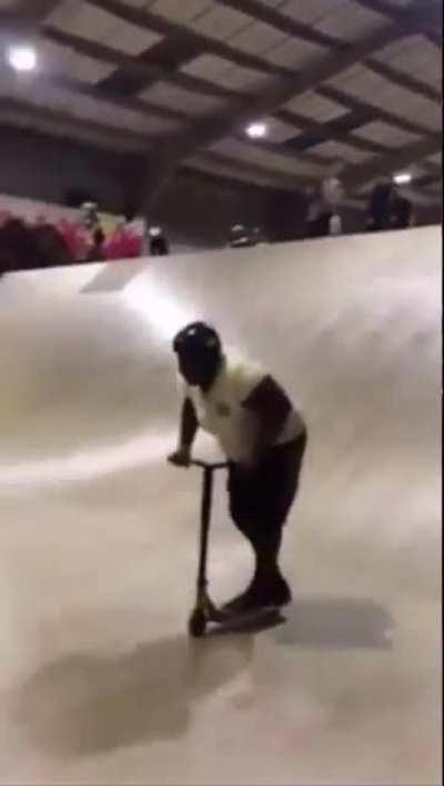 Look at this fat nigga on a scooter
