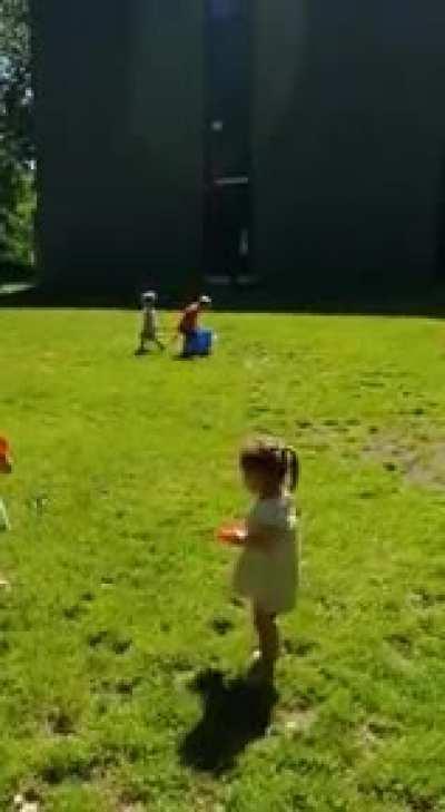 Teaching the kid how to frisbee. Nowhere is safe.