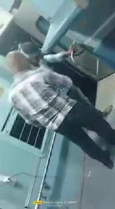A man tosses another individual from a train.