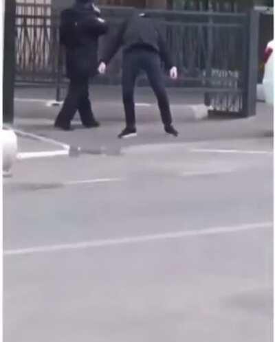 Policeman in Russia not sure what to do with this guy