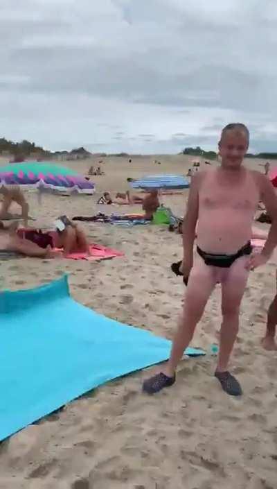 Shameless blowjob on a beach