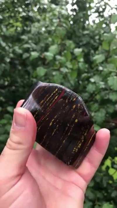 This is one of the most beautiful stones that I’ve ever seen. This is a type of banded iron formation called Tiger Iron. The yellow is tiger eye. The red is Jasper. The dark banding is hematite.