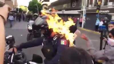 Raw footage from Mexico. The unrest in the city of Guadalajara has been caused by the death of a local resident during detention. One protester sets a police officer on fire.