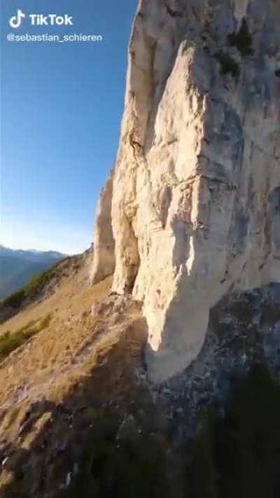 climbing on the side of this cliff