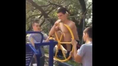 Guy holds onto a wheel and smashes his head.