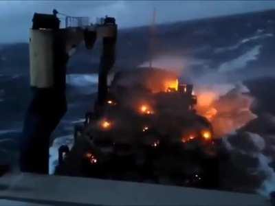 This looks terrifying apocalyptic alike, burning cars on a ship out in the ocean