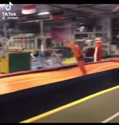 Gymnasts overshoots a tumble and lands hard on her belly