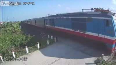 After hitting the railway crossing barrier he almost run over by the train.
