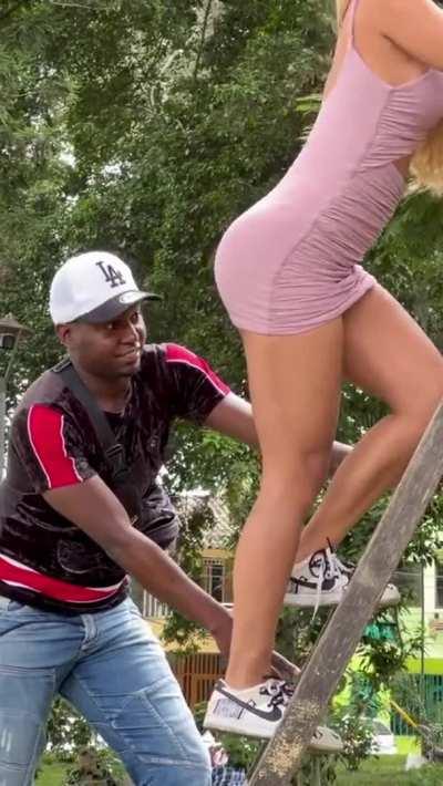 Beautiful Blonde Climbs Stairs in a skirt and teases men