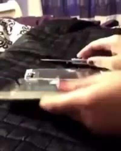Idiot gets into knife fight with cellphone battery
