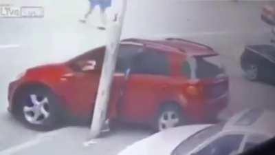 Woman gets leg snapped between car door and post
