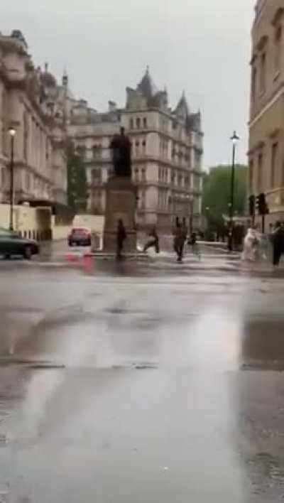 Police horses are loose and knocking over people as they run through the streets of London.