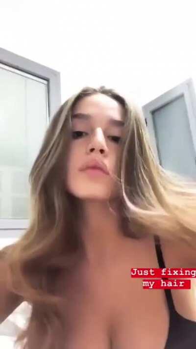 just fixing her hair