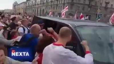 Undercover police in Belarus getting punched up by protestors and forced back into their van.