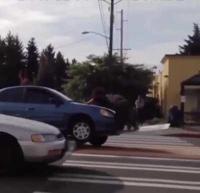 Trying to use the sign you ran over as a lever to free your vehicle.