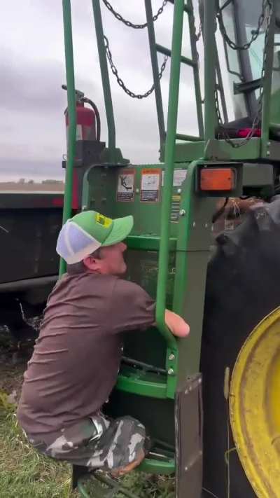 Born limbless, farmer Chris Koch demonstrates how he gets up into the combine