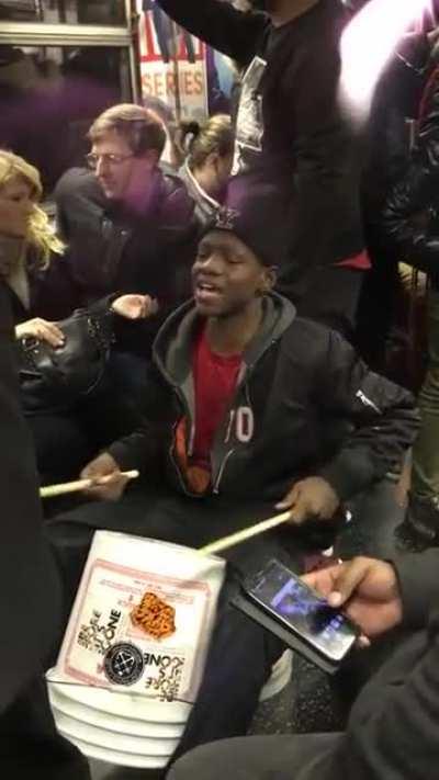kid playing drums on nyc subway and kills it!