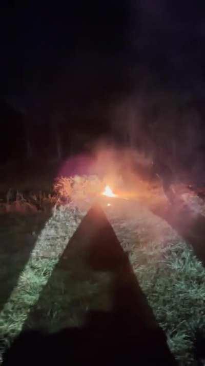 Shooting a flaming arrow at gasoline soaked Christmas trees