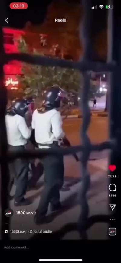 Police force in Iran shooting their pistols at people thinking nobody sees and they can get away with it