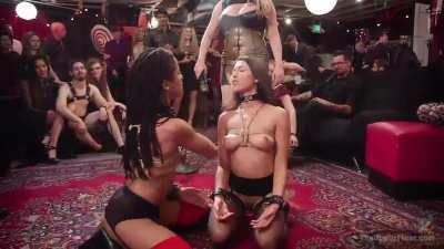 Two girls fucked in a crowded place.