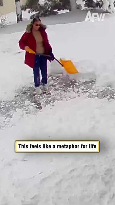 More snow falls from roof as woman tries to clear it,