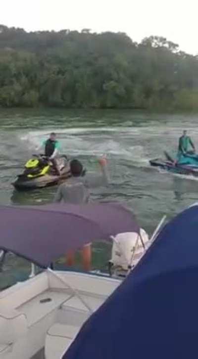 Throwing a glass bottle at a jetski