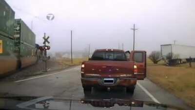 Truck hit by train runs over cop, Cop survives