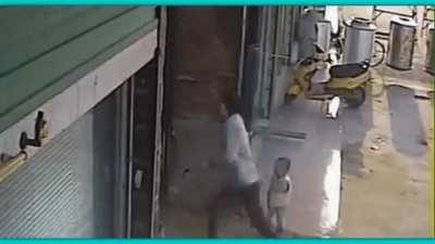 Guy went to an alley to beat someone, someone's relatives came to help so guy has to escape and need a distraction.