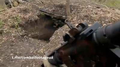 Foreign volunteers fighting as part of the International Legion of the Ukrainian Armed Forces after storming Russian positions take some Russian soldiers prisoner. The exact date and location are unknown.