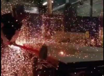 A red hot ball of steel, struck with a hammer.