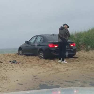 Takes talent to lock yourself out of your car while it's in gear and stuck on the beach