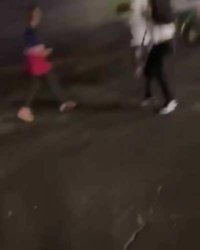 Trying to wheelie in a crowded parking lot