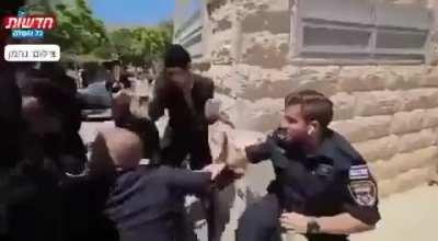 Jews who were demonstrating against violence towards Palestinians in front of the military recruitment office in Israel were beaten by the Israeli police.