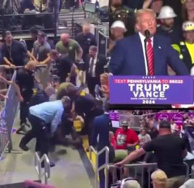 Man attacks media at Trump rally after Trump attacked them - as he's being restrained by security, Trump says 