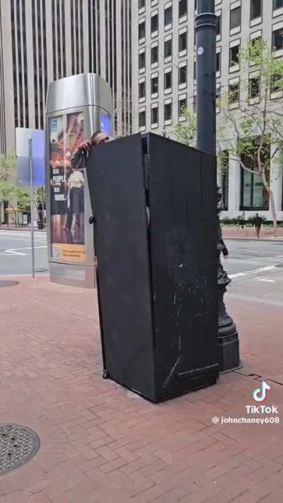 Guy stuck inside of a black thing.