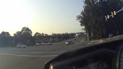 Failed a left turn, hit two curbs.