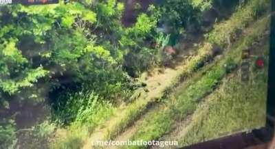 Katsap takes off the shoes of his dead colleague.