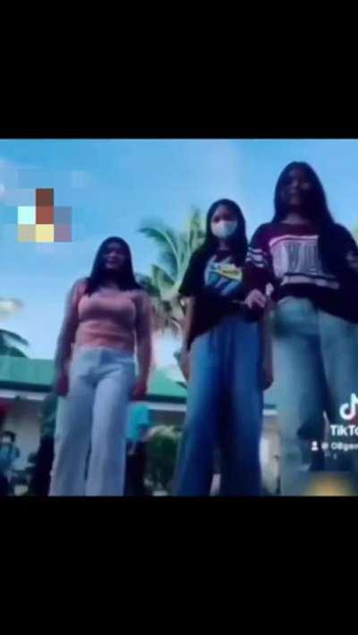 To make a TikTok on a busy street 