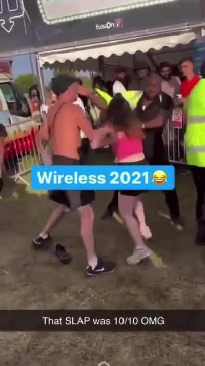 Girl attacks security guard at Wireless Festival. Gets knocked out with a slap.