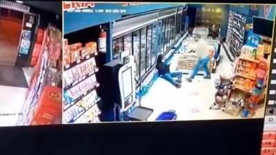 He didn't even have time to pull out the weapon. The masked robber got what he deserved.