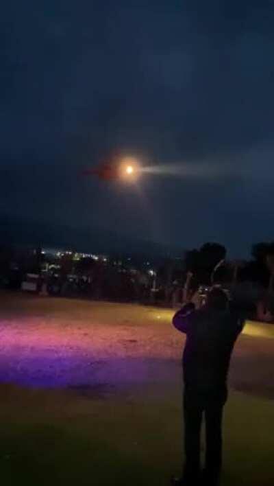 I don't know the 5 W's but this person has clearly exited the gene pool. Never walk up to the front of a helicopter while the rotor is spinning.