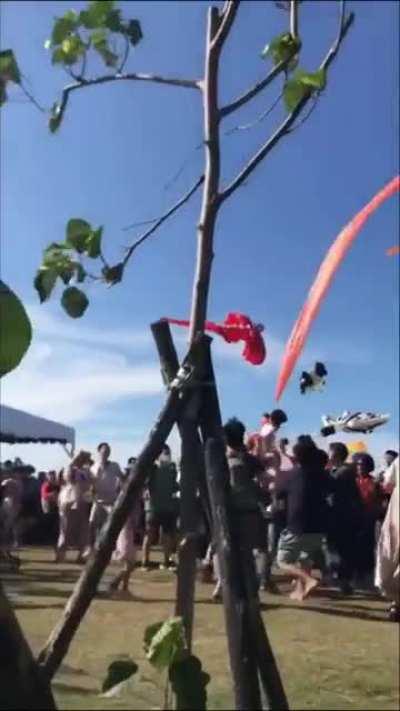 Kid being brought up into sky by a kite today in Taiwan