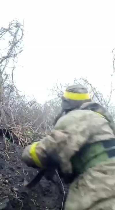 AFU soldier films a quick message amidst heavy fire in Eastern Ukraine (Untranslated)