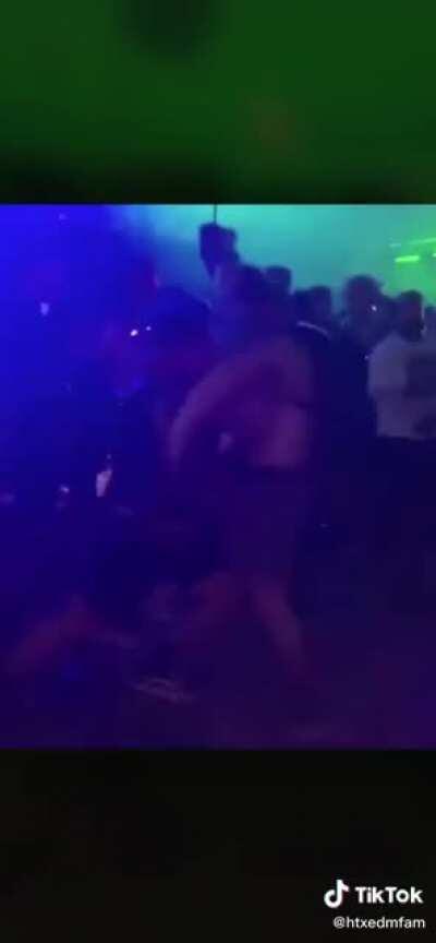 Jerk running around shoving people at a rave gets what he deserves and the crowd cheers.