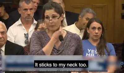 Nurse tries to prove COVID vaccines MAGNETIZE people to Ohio Legislature by sticking metal object to her neck - only for it to FALL off