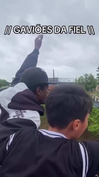 Football team supporters impress with their energy while singing.