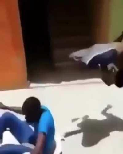 Kid doing a back flip off a plastic chair