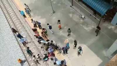 Woman in Bangladesh attempts suicide by train but miraculously survives with only leg injury.