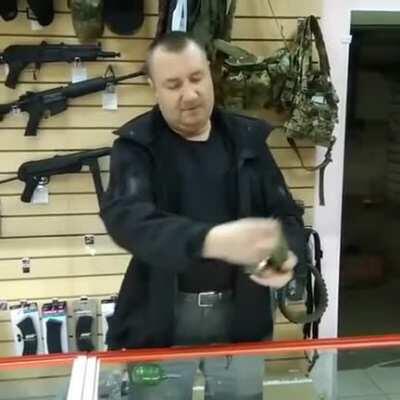 Russian man showing how to use a Grenade 